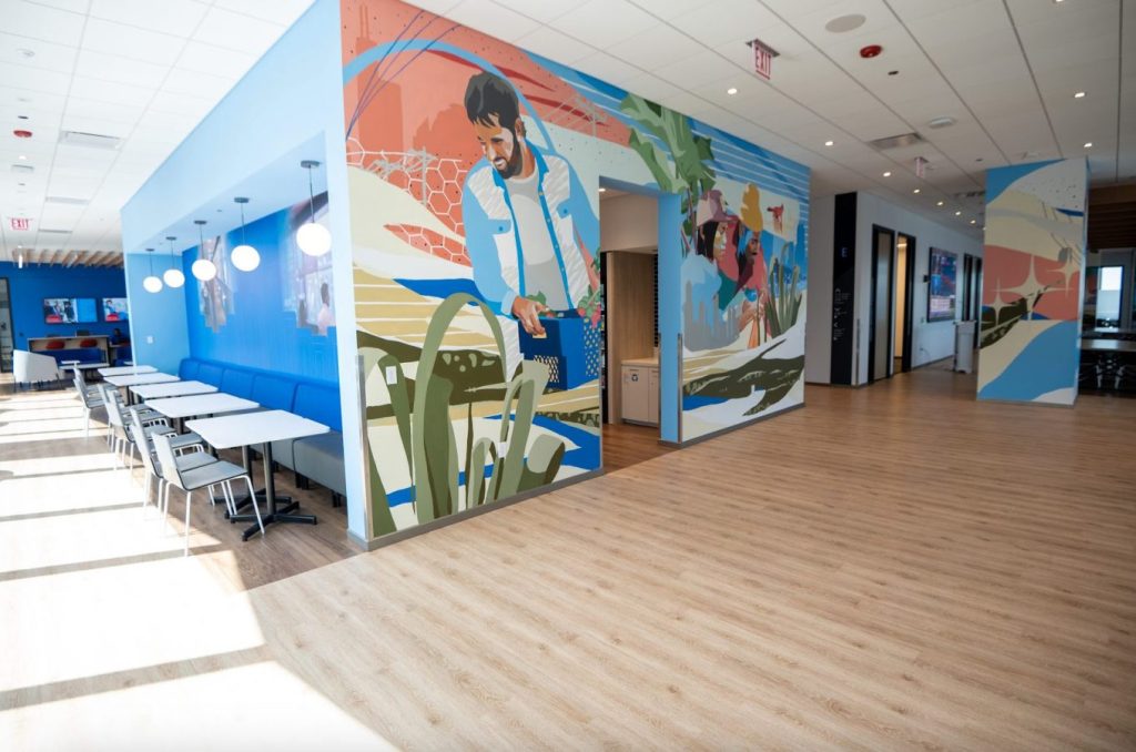 A vibrant custom office mural in trendy office.